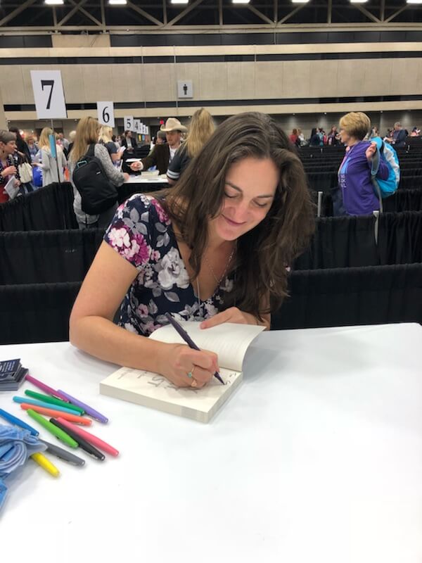 Samantha M Clark signing THE BOY, THE BOAT, AND THE BEAST at TLA 2018.