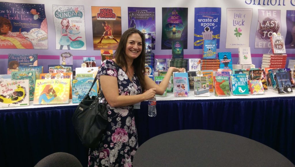 Samantha M Clark with THE BOY, THE BOAT, AND THE BEAST at the Simon & Schuster booth.