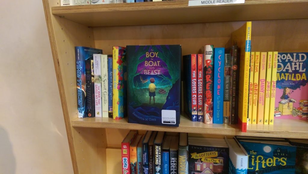 Signed copies of THE BOY, THE BOAT, AND THE BEAST on the Skylight Books shelves.