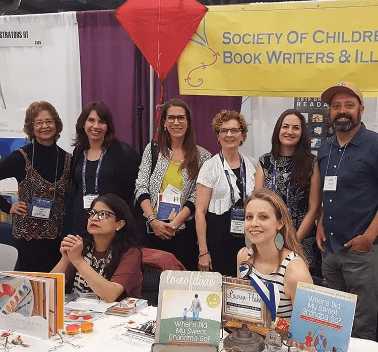 Me with a bunch of Austin SCBWI authors and illustrators at our booth at TLA 2019. So much fun.